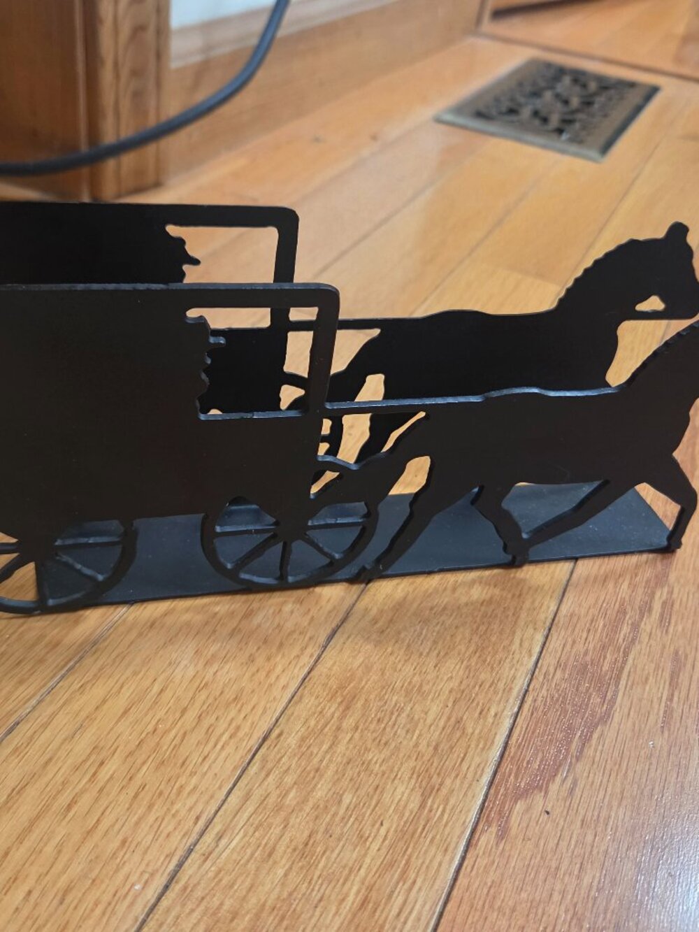 black metal napkin holder or letter holder shaped like horse drawn carriage